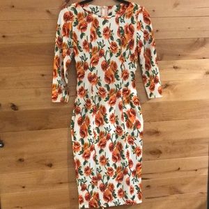 A-line dress with back zipper and slit.